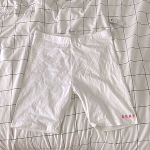 White biker short, pink brand label on left leg, DKNY, 14/16